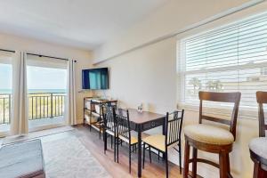 Modern oceanfront condo with outdoor pool, balcony, & washerdryer