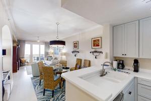Luxurious oceanfront condo with private balcony, 2 pools, and beach access