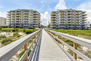 Luxurious oceanfront condo with private balcony, 2 pools, and beach access