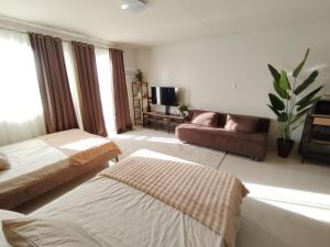 Puerto Princesa Studio Condo with 2 Large Beds, Balcony, Pool & Gym