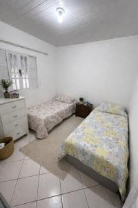Casa pé na areia em Marataizes na cidade nova