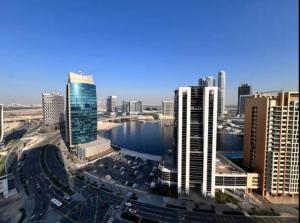 Vogue Vacation Homes, Downtown Mag 318 near Burj Khalifa and Dubai Mall, Studio Apartment with Balcony and City View, Access toAmenities