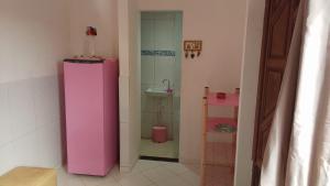 Casa Rosa da Ilha - Suíte Confortável com Ventilador e Jardim