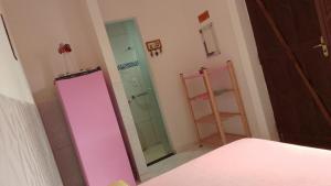 Casa Rosa da Ilha - Suíte Confortável com Ventilador e Jardim