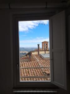 Dimora con finestra sui tetti di Siena