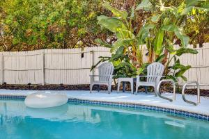 Family Putting Green Oasis BBQ Cornhole Heated Pool