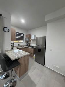 Departamento+balcón con vista a la laguna