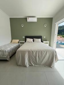 Casa 3 suítes, 1 quadra da praia de Barequeçaba