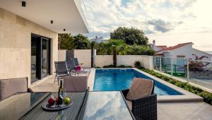 Villa TATJANA SOL with a pool, hot tub, gym