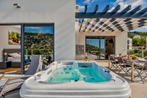 Villa TATJANA SOL with a pool, hot tub, gym