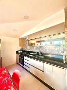 Apartamento com terraço privativo e vista mar