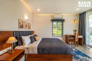 StayVista at Lagoons Kuruva with Shared Pool, Lawn