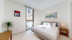 Vacationer Holiday Homes l Contemporary 2 Bedroom l Pool, Gym, Private Beach Access
