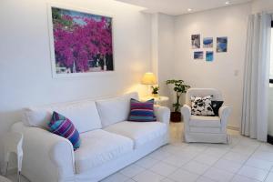 Flat em frente ao mar com piscina varanda e AC