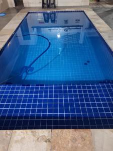 casa com piscina Espaço para laser