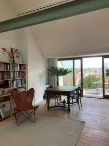 Penthouse studio in a family house