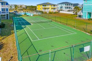 Condo near the beach with pool, BBQ area, balcony, & fireplace