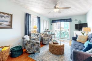 Condo near the beach with pool, BBQ area, balcony, & fireplace