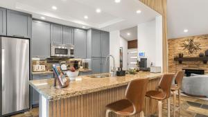 Design-forward Palm Springs home w saltwater pool lush yard multiple outdoor dining areas Casa Papagayo by AvantStay