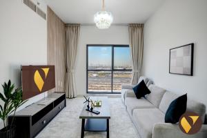 Vogue Vacation Homes, Dubai International City Olivz by Danube near Dragon Mart, One Bedroom Apartment with Balcony and City View, Access toAmenities