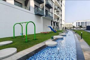 Vogue Vacation Homes, Dubai International City Olivz by Danube near Dragon Mart, One Bedroom Apartment with Balcony and City View, Access toAmenities