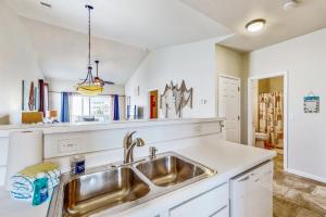 Pond-front condo near beach with balcony, pool, & hot tub - snowbird-friendly