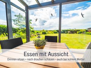 Huus Binnensee - Erdgeschoss-Wohnung mit Garten & Seeblick - Wintergarten & Terrasse - hundefreundlich - ruhige Lage - Südstrand 5 Min mit Rad