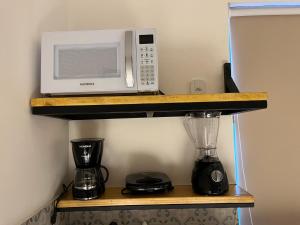 Flat com ar e varanda com linda vista para o Ibituruna, Wi-Fi - Véu de Noiva 204