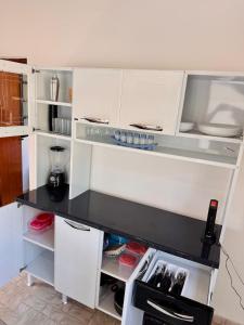 Casa aconchegante, 5min a pé da praia!