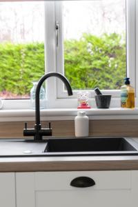 Stylish 3-Bed Home with Private Garden in Airdrie