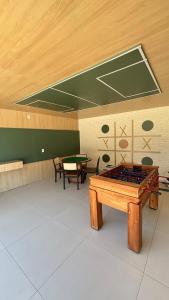 Apartamento com varanda pé na praia em condomínio