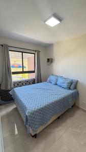 Apartamento com varanda pé na praia em condomínio