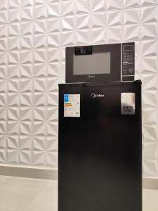 Studio Bem localizado, WIFI Rápido, Ar Condicionado e Estacionamento 1