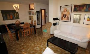 Apartment with pool by the sea