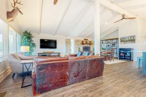 Stunning dog-friendly home with game room, hot tub, water view, & WD