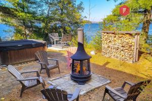 Aux Berges du Pont Suspendu - Chalet Île privée Spa Bord du lac - Estrie