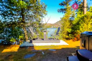 Aux Berges du Pont Suspendu - Chalet Île privée Spa Bord du lac - Estrie