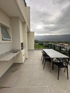 Apartamento em Bertioga com churrasqueira