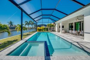 CoralVilla Palms - modern & cozy, south facing, spa, billard, canoe