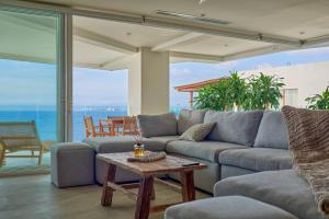Sunset Getaway with Oceanfront Terrace and Resort Perks