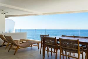 Sunset Getaway with Oceanfront Terrace and Resort Perks