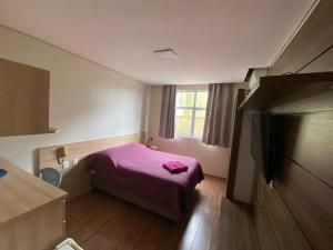 Flats da Júnia 110 - funcional com ar, garagem, tv, microondas, frigobar e 14 km aeroporto