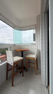 Apto pé na areia em Praia Grande!