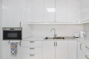 Spacious 2BR Retreat with Balcony in Uptown Mirdif