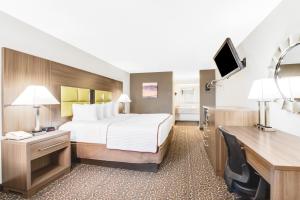 Queen Room with Two Queen Beds - Smoking room in Super 8 by Wyndham Big Spring TX