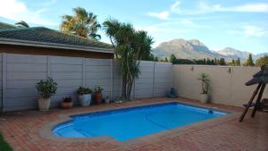 A gorgeous apartment with a pool view at Goedehoop, Strand, Western Cape