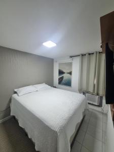Suíte completa e poucos metros da praia