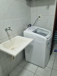Suíte completa e poucos metros da praia