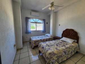 6 huéspedes a 2 min del Pez Vela y Parking privado