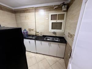 شقة مريحة بالتجمع على بعد دقائق من Auc